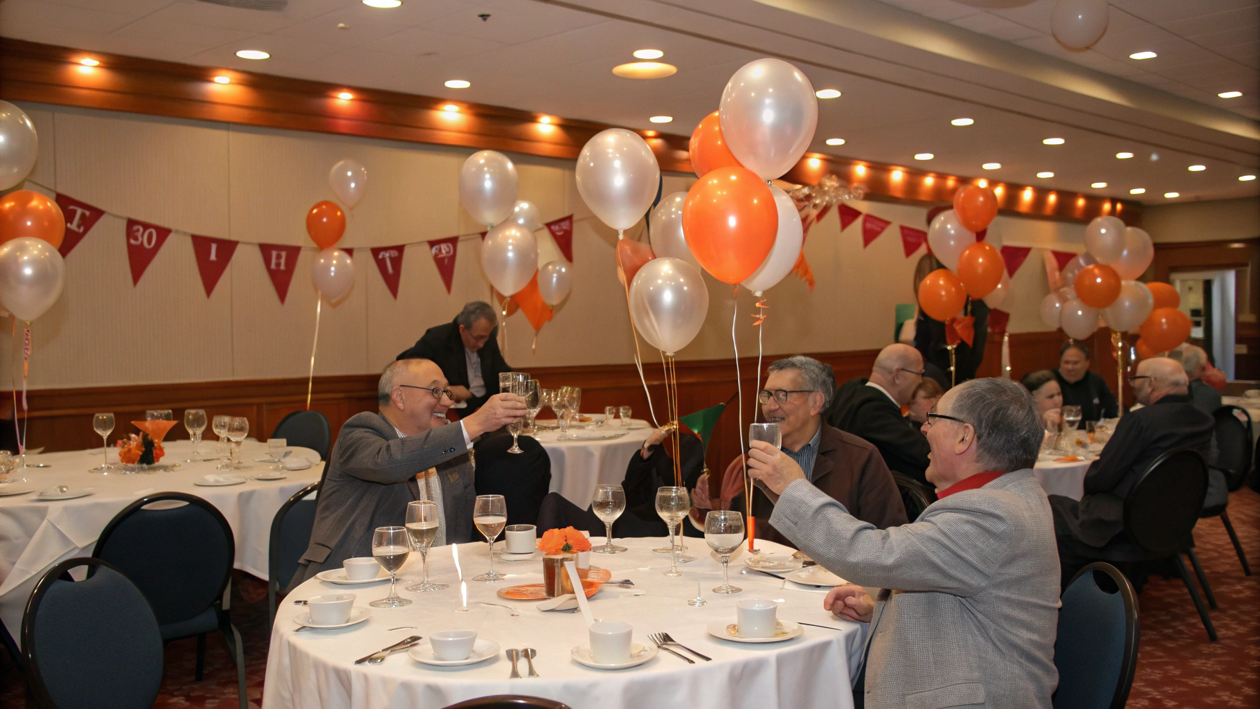 Silver jubilee reunion celebration setup with varsity banners and golden accents